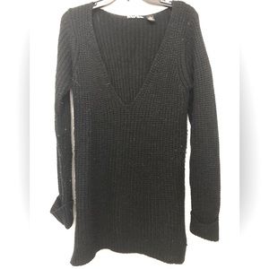 Comfy longer Black Vneck sweater with little slits on the sides.